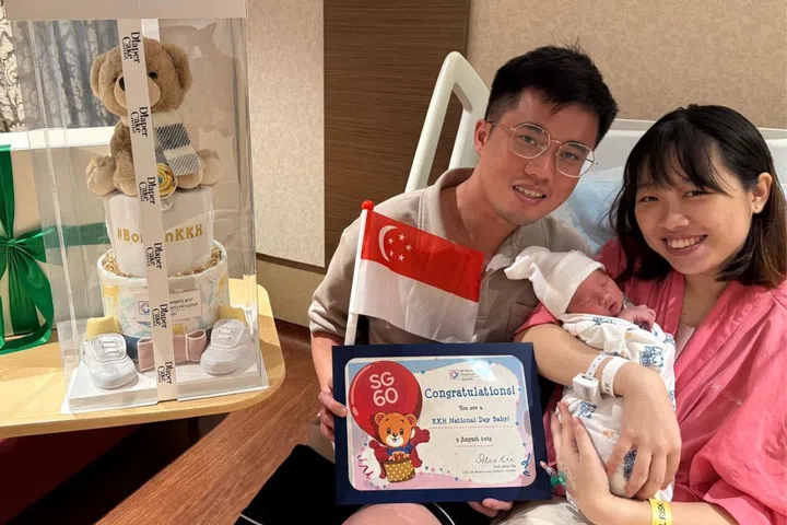 Tay Chun Arn, 31, and Lau Ni Yin, 28, with their firstborn Declan Tay.