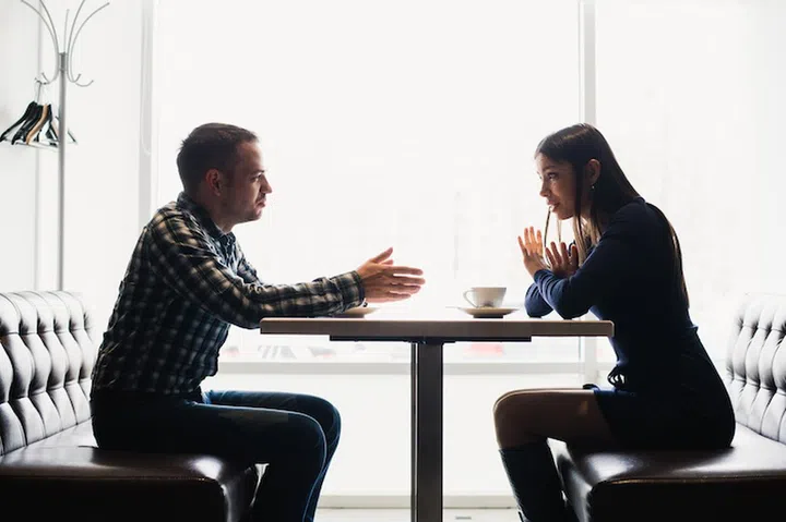 Scene in cafe - couple conflict arguing during the lunch