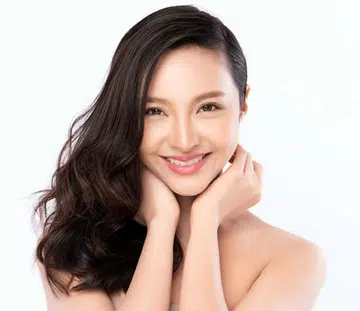 pretty asian woman with flowing hair over one shoulder