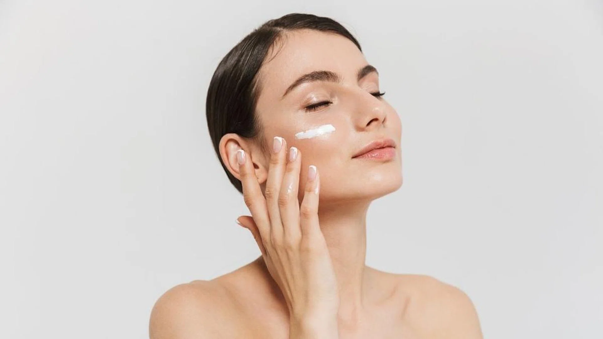 woman applying skincare