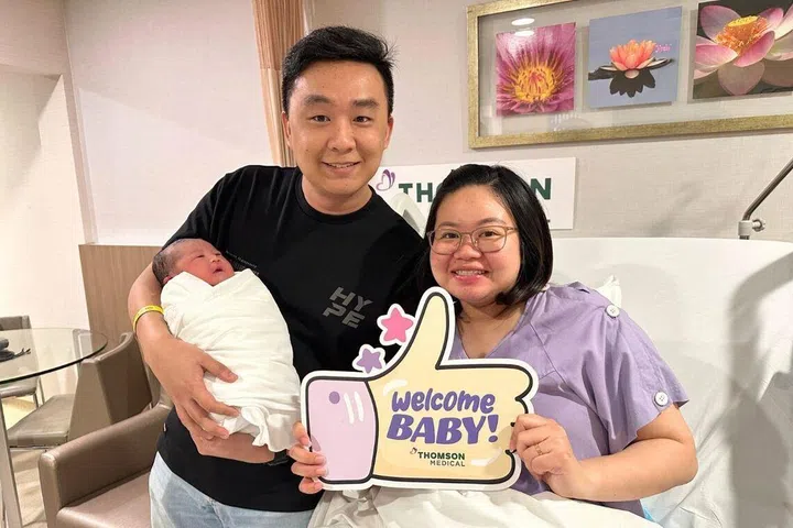 First-time parents Choo Fong Yin, 30, and Kee Wai Chong, 31, with their baby girl Kee En at Thomson Medical Centre
