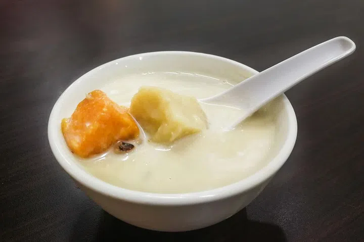 Bubur Cha Cha is sweet desert made of coconut milk, sweet potatoes and taro. Popular in Malaysia.