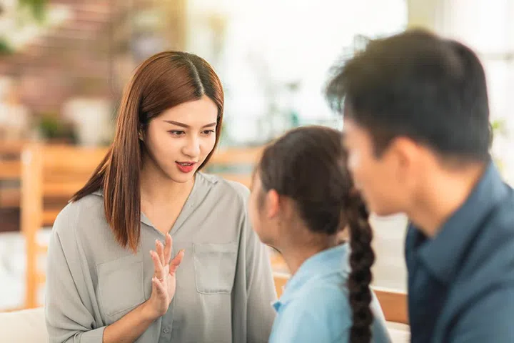 Mother having serious conversation with  daughter at home