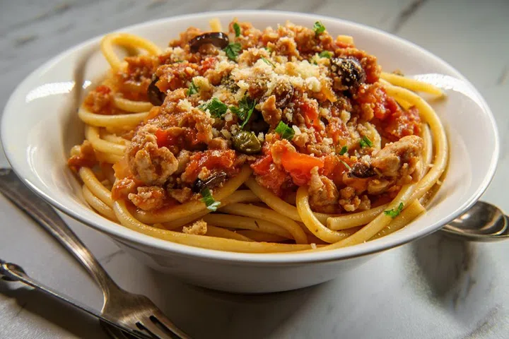 Bucatini Italian ragu alla Bolognese sauce with sausage and toasted garlic bread crumbs
