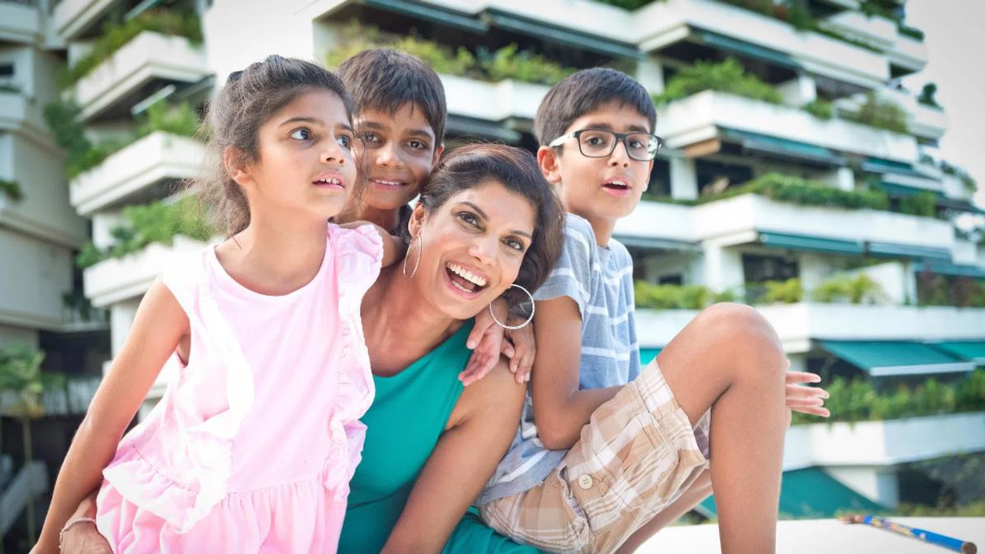 Manisha with her three children, aged seven, nine and 11. (Credit:  Hayley Durack Photography)