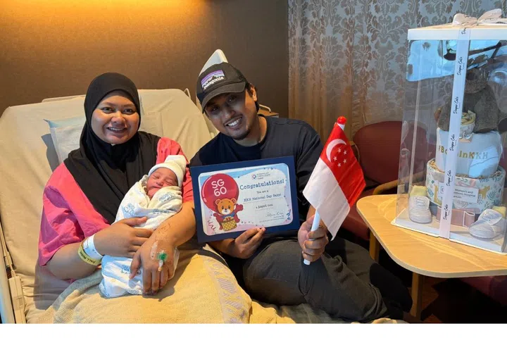 Norshahidah Binte Mohd Salleh, 33, and Muhammad Hanif Bin Ramli, 32, with their secondborn Muhammad Uwais Iman Bin Muhammad Hanif.