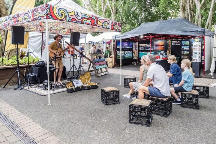Guests enjoying street performers at Eumundi Markets, Sunshine Coast, Queensland