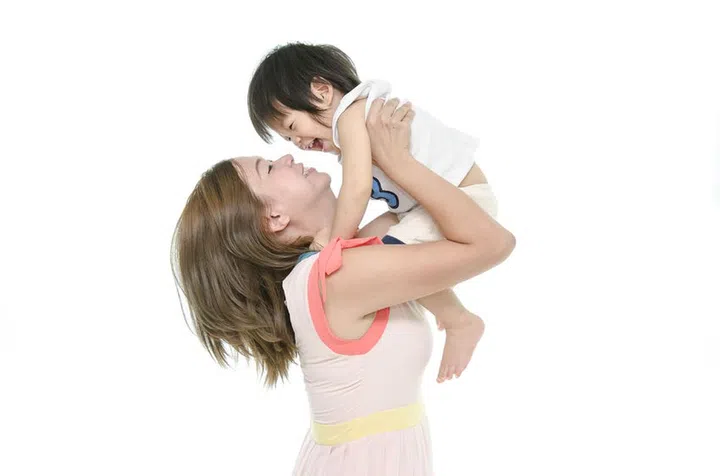 30399490 - asian mother and baby kissing, laughing and hugging