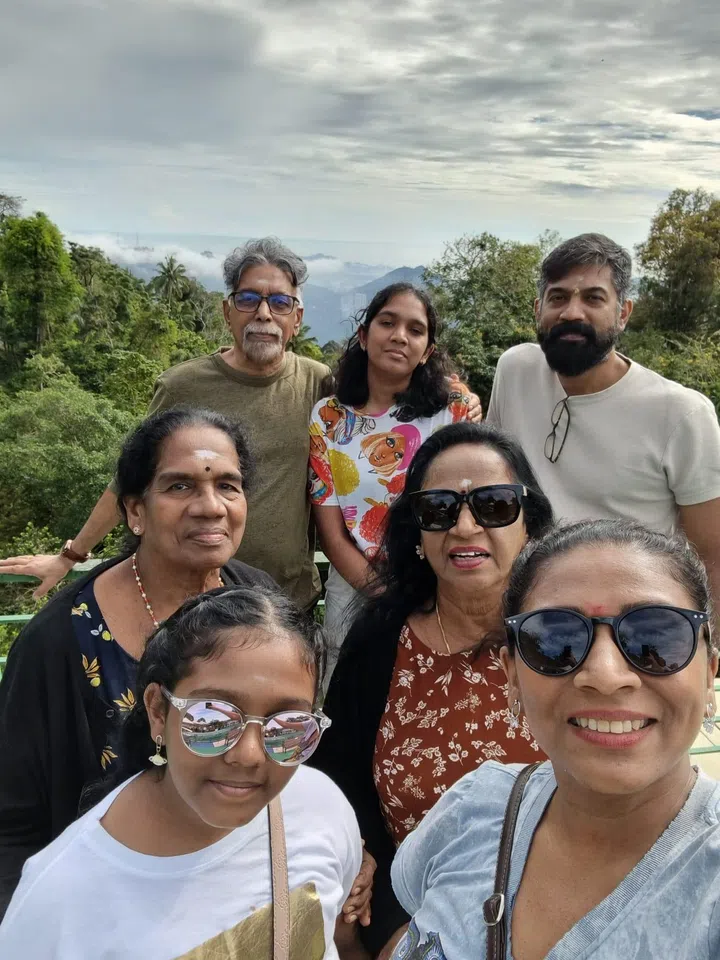 sandwiched mum kasthuri with her parents, husband, mother-in-law and two daughters