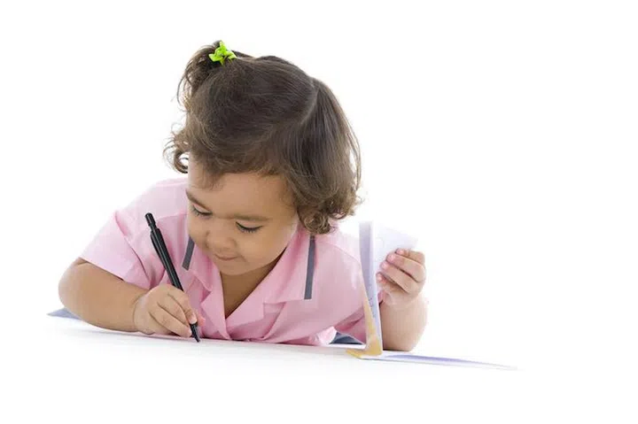 7955029 - cute 2 years old girl writing something, isolated on white background