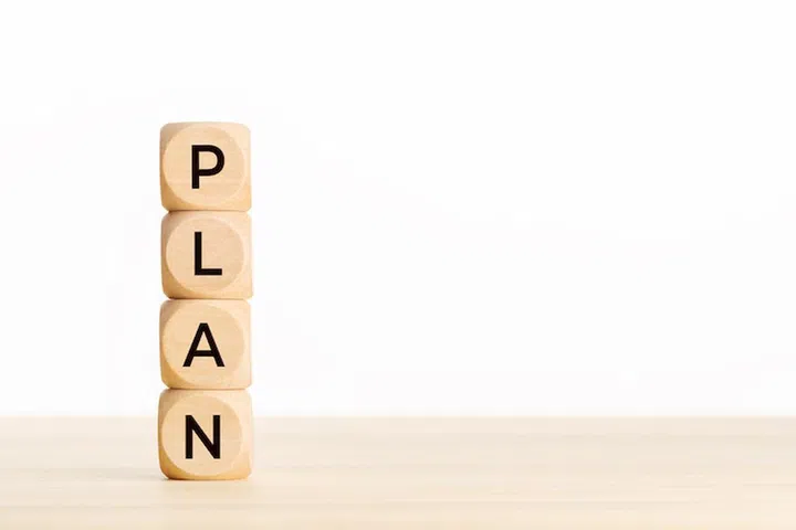 Plan concept. Wooden block with text on table. Copy space