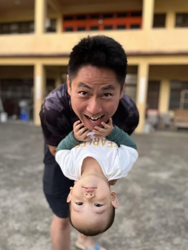 ST senior executive photojournalist Neo Xiaobin snapped this "mirror image" of her husband Kevin Lim and son Kayen using her phone's portrait mode. PHOTO: COURTESY OF KEVIN LIM