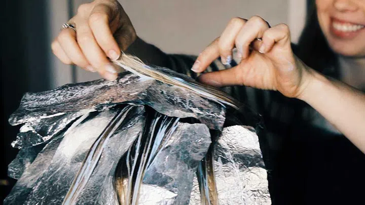 Like the move from heavy foundations to lighter ones, most experts agree it's best to blend emerging greys into your natural colour than hide it completely.
