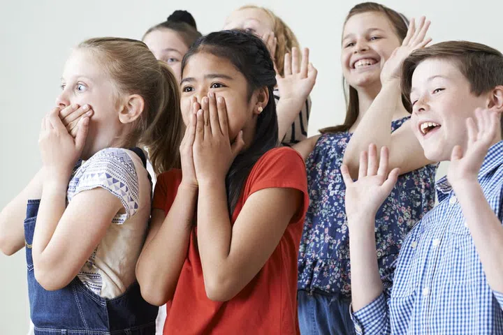 58984051 - group of children enjoying drama class together