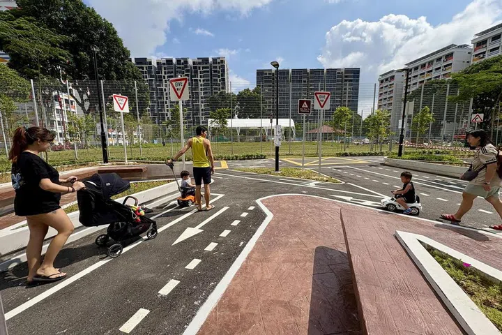 The park is a miniature road network, complete with directional arrows, zebra crossings and yellow boxes. ST Photo: Elisa Chia