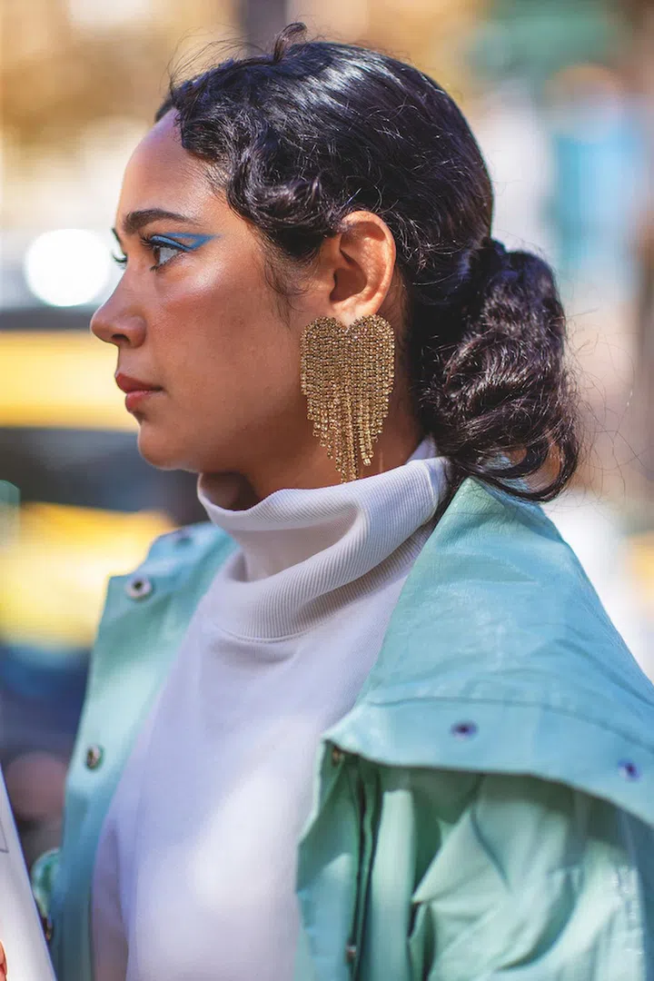 A fashion person in a Street Style photo out of Miu Miu Spring Summer 2022 Women Ready to Wear Fashion Show on October 2021 in Paris, FR