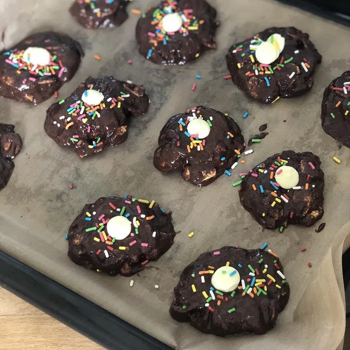 03. Use your hands to roll dough into small balls. Place on your baking sheet and flatten balls slightly with a fork, your hands or bottom of a glass.