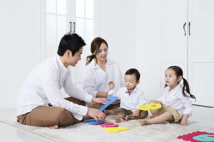 Happy Asian Family Playing with Sponge Digits/Numbers at Home
