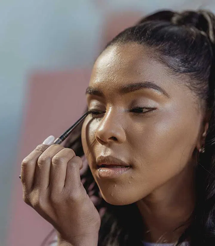 For a lifting eyeliner, start to turn the flick upwards from a few lashes in, rather than from the last lash. (Photo by George Milton from Pexels)