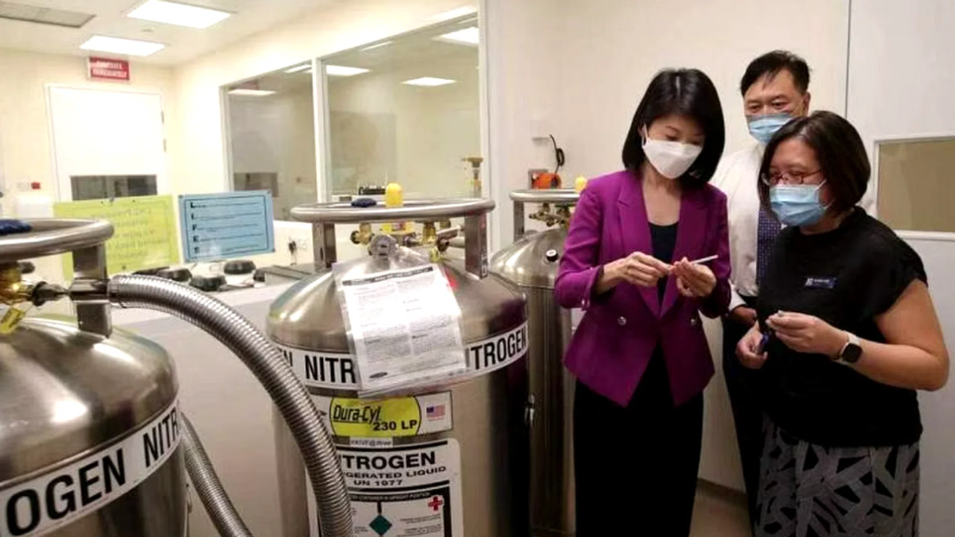 Minister of State for Social and Family Development and Home Affairs Sun Xueling (left) touring the Liquid Nitrogen Room at the KK Women’s and Children’s Hospital's in-vitro fertilisation centre on May 15. ST photo: Gin Tay