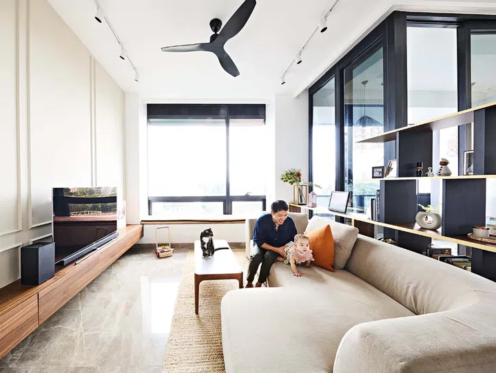 An open shelving unit divides the space.