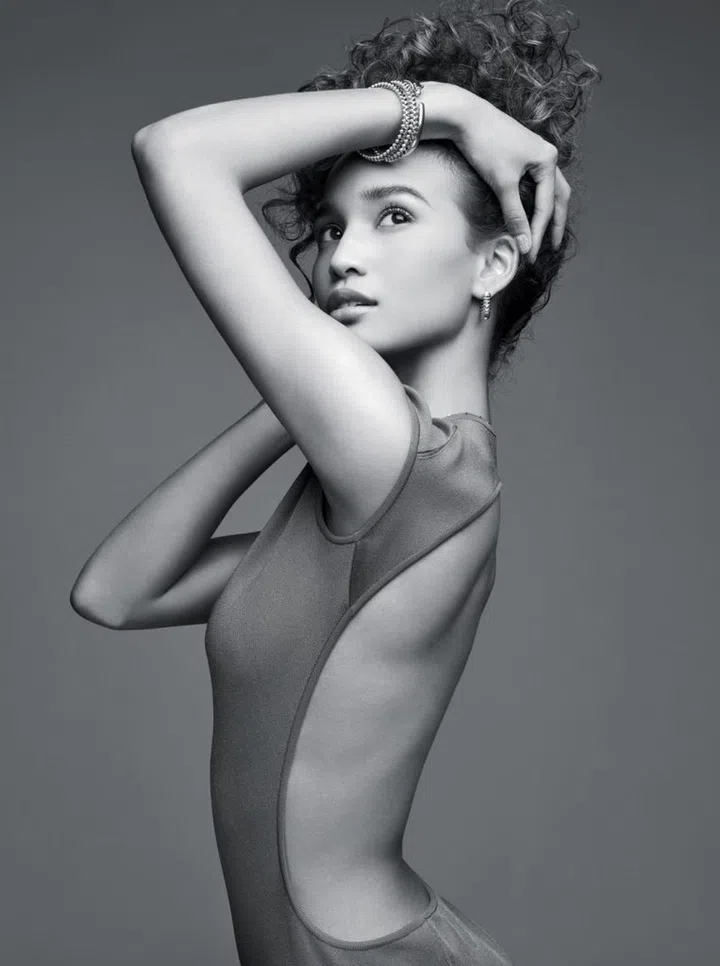Stretch cotton bodysuit, Hermes Clash de Cartier pink gold small hoop earrings, Clash de Cartier white gold medium bracelet, Clash de Cartier pink gold small bracelet, and Panthere de Cartier yellow gold, tsavorite garnets and onyx bracelet