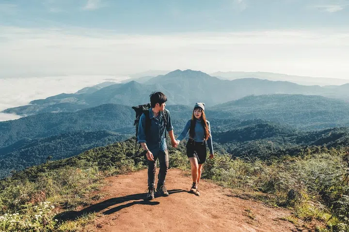 Adventures Couple trail hiking in the forest