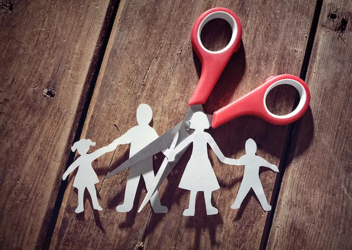 Divorce and child custody scissors cutting family apart