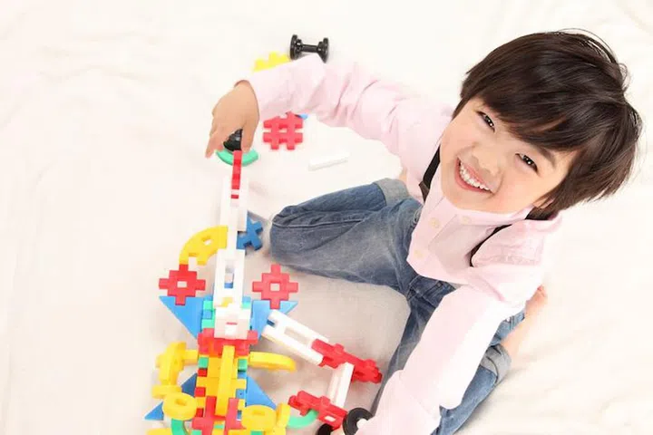 13829180 - asian boys play with toys