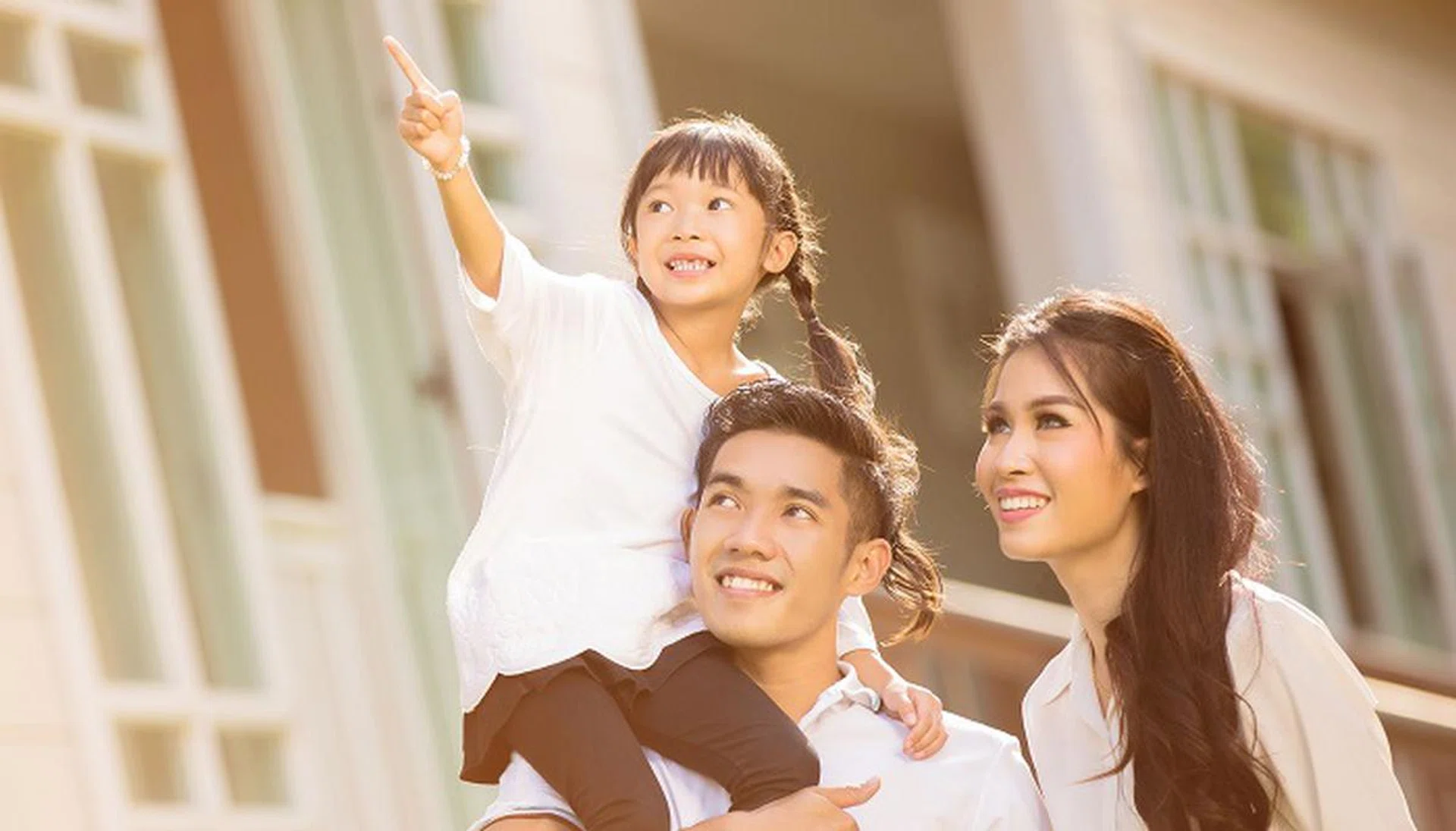 Asian family Happy Daughter pointing parents to look after her