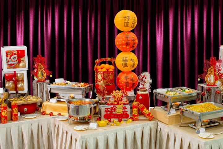Add some festive flair to your feast with the Chinese New Year buffet setup. Credit: Chilli Manis Catering