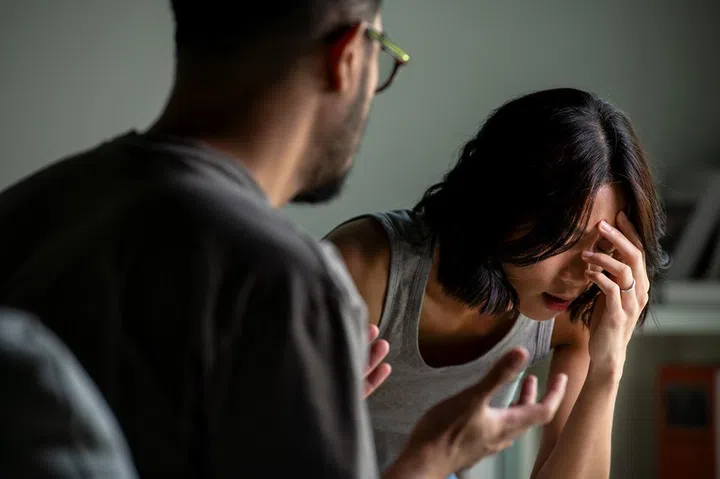Young Asian married couple after a fight, Angry couple ignoring each other, relationship troubles.