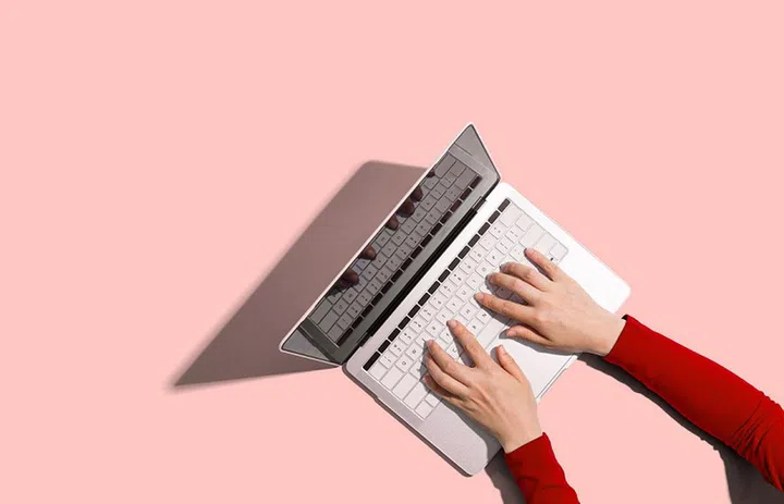 Person using a laptop computer from above