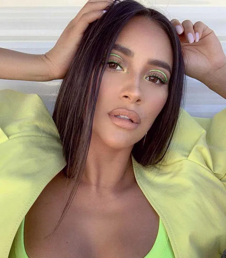 Shay Mitchell shows off her neon green classic cat eyeliner.