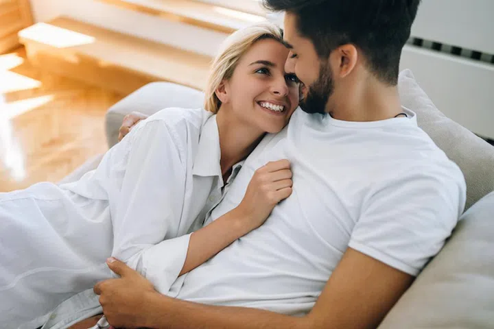 Romantic cute couple in bed being intimate