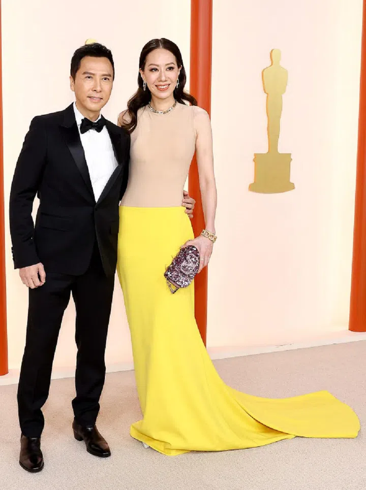 HOLLYWOOD, CALIFORNIA - MARCH 12: (L-R) Donnie Yen and Cissy Wang attend the 95th Annual Academy Awards on March 12, 2023 in Hollywood, California. (Photo by Arturo Holmes/Getty Images )