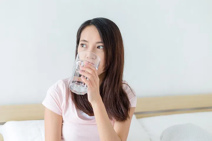 Woman drinking a glass of water
