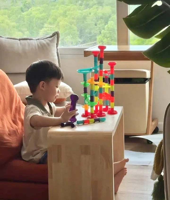 toddler screen addiction - Our 3-year-old looks forward to engaging with various play setups, such as the marble run set. 