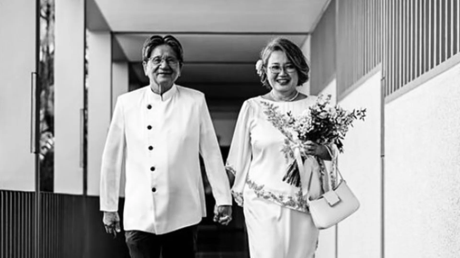 Ms Sylvia Lim posted a black and white picture of her and Quah Kim Song walking hand in hand down a corridor at the St Mary of the Angels church. Photo: @sylvialim65/Instagram