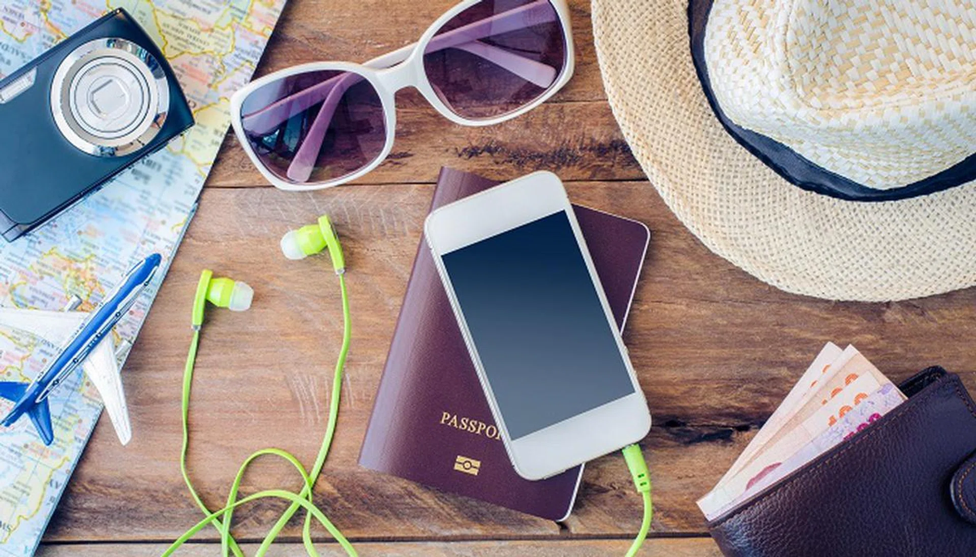 Travel accessories costumes. Passports, luggage, eyewear The cost of travel maps prepared for the trip