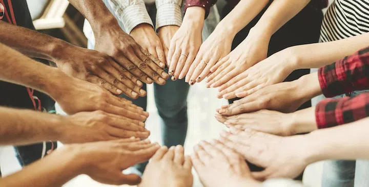 Group of hand touching together in circle shape, power of cooperation concept