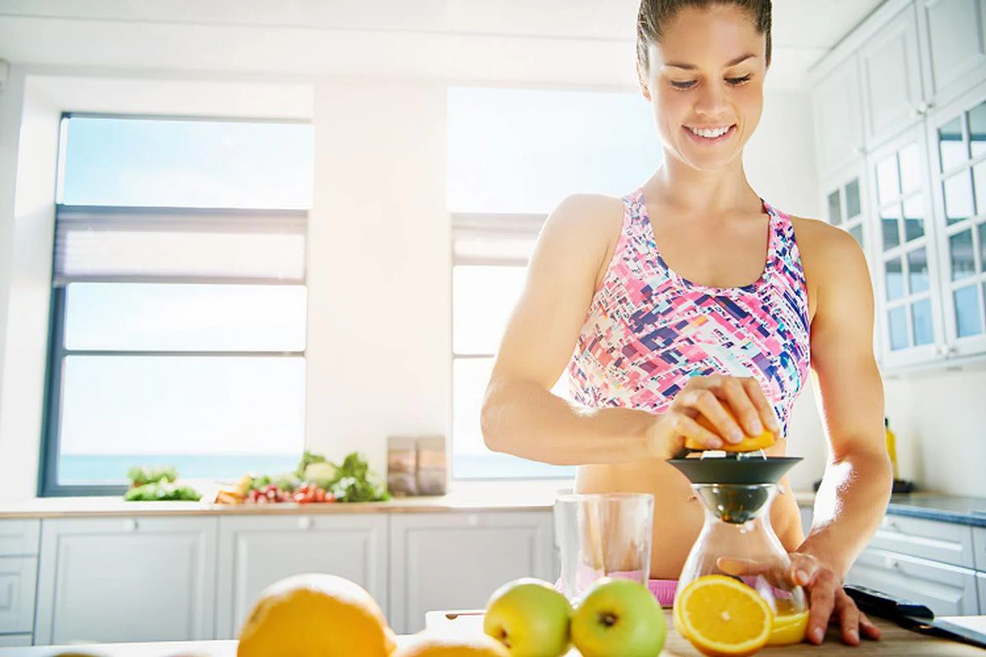 Happy woman standing in sunlight  - 123RF