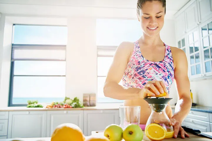 Happy woman standing in sunlight  - 123RF