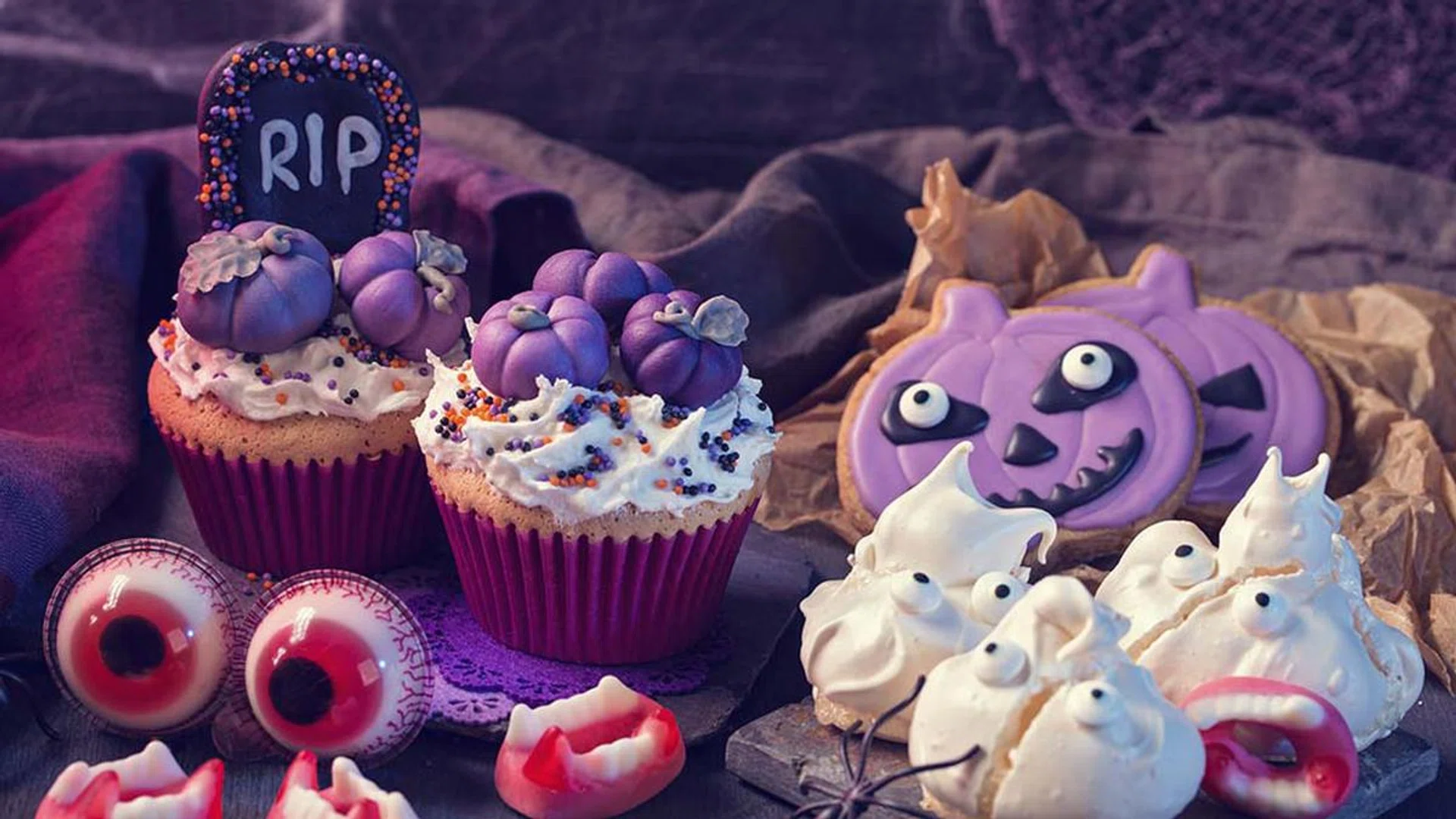 Sweets for halloween party on a wooden background