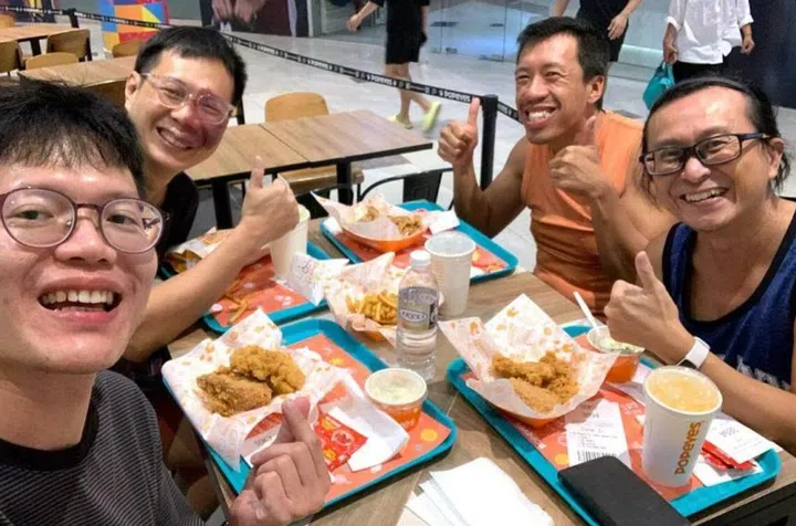 Members of The Ordinary Dad community and founder Cliff Tam (second from right) having a meal together. PHOTO: COURTESY OF CLIFF TAM