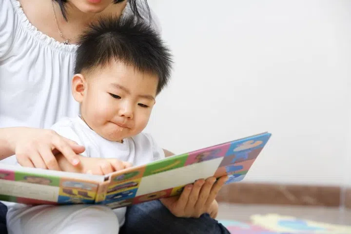 5381865 - asian mother tutoring her son for early education