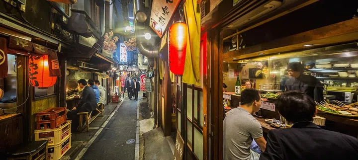 Shinjuku, Omoide Yokocho (lit. memory lane, also known as Piss Alley), an area with traditional small restaurants that serve food along the tracks northwest of Shinjuku Station.