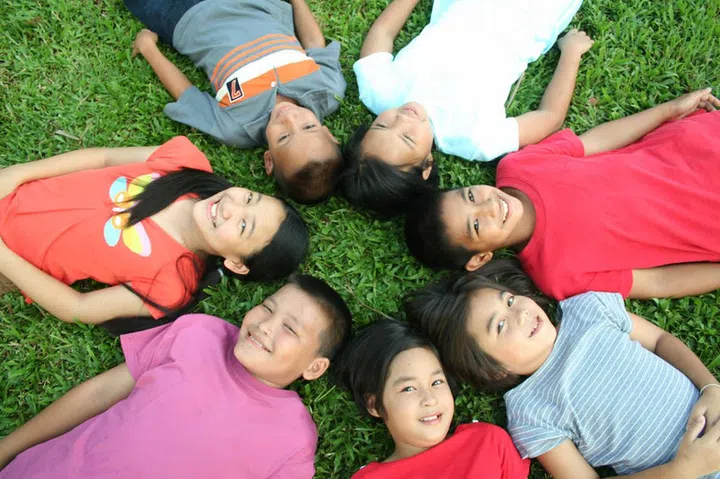51685808 - seven children sleeping in the park.