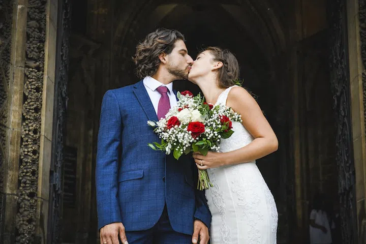Newly wed couple on the church steps