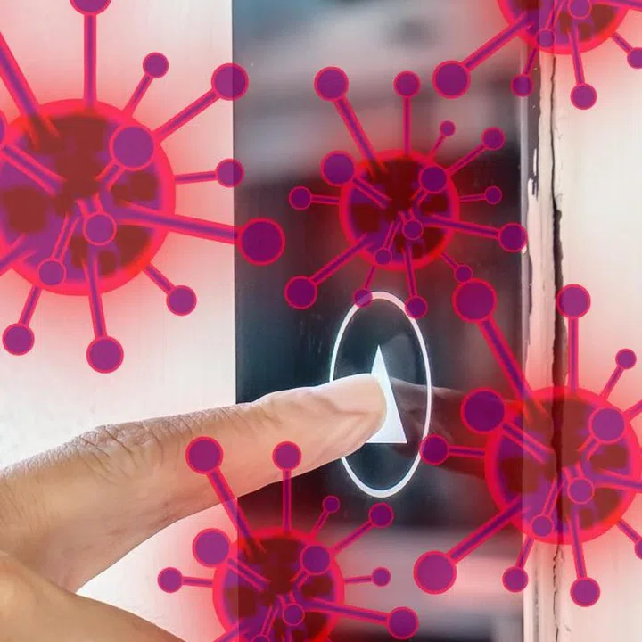 Man hands finger press button in elevator with virus. Covid-19 or Coronavirus in the elevator button that are touching hands. Button with virus around the elevator or lift.